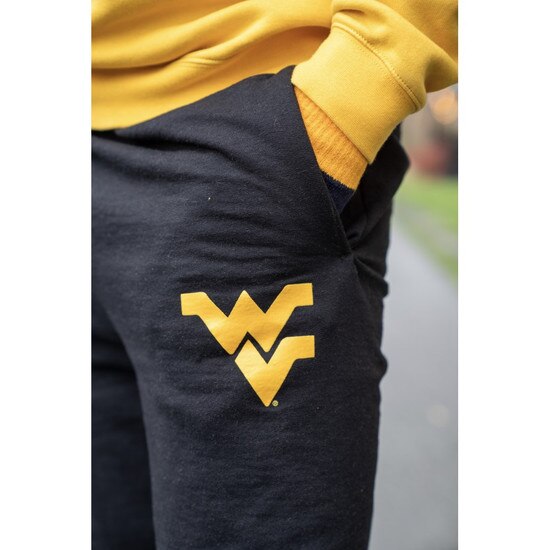 Model wearing the Black WVU sweatpants with a Flying WV Logo screen print at upper left leg