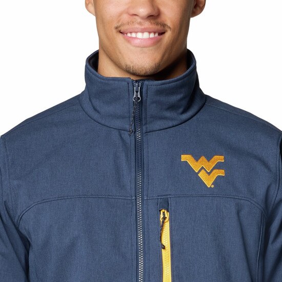 Close up of the navy Columbia WVU full zip jacket with zippered left chest pocket and embroidered gold Flying WV on left chest.